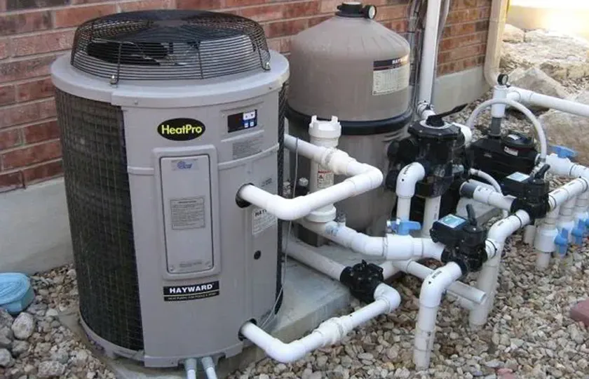 Silverback technician servicing a pool plumbing system at a Helotes home